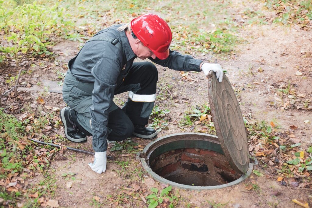 plumber inspecting a sewer line issue
